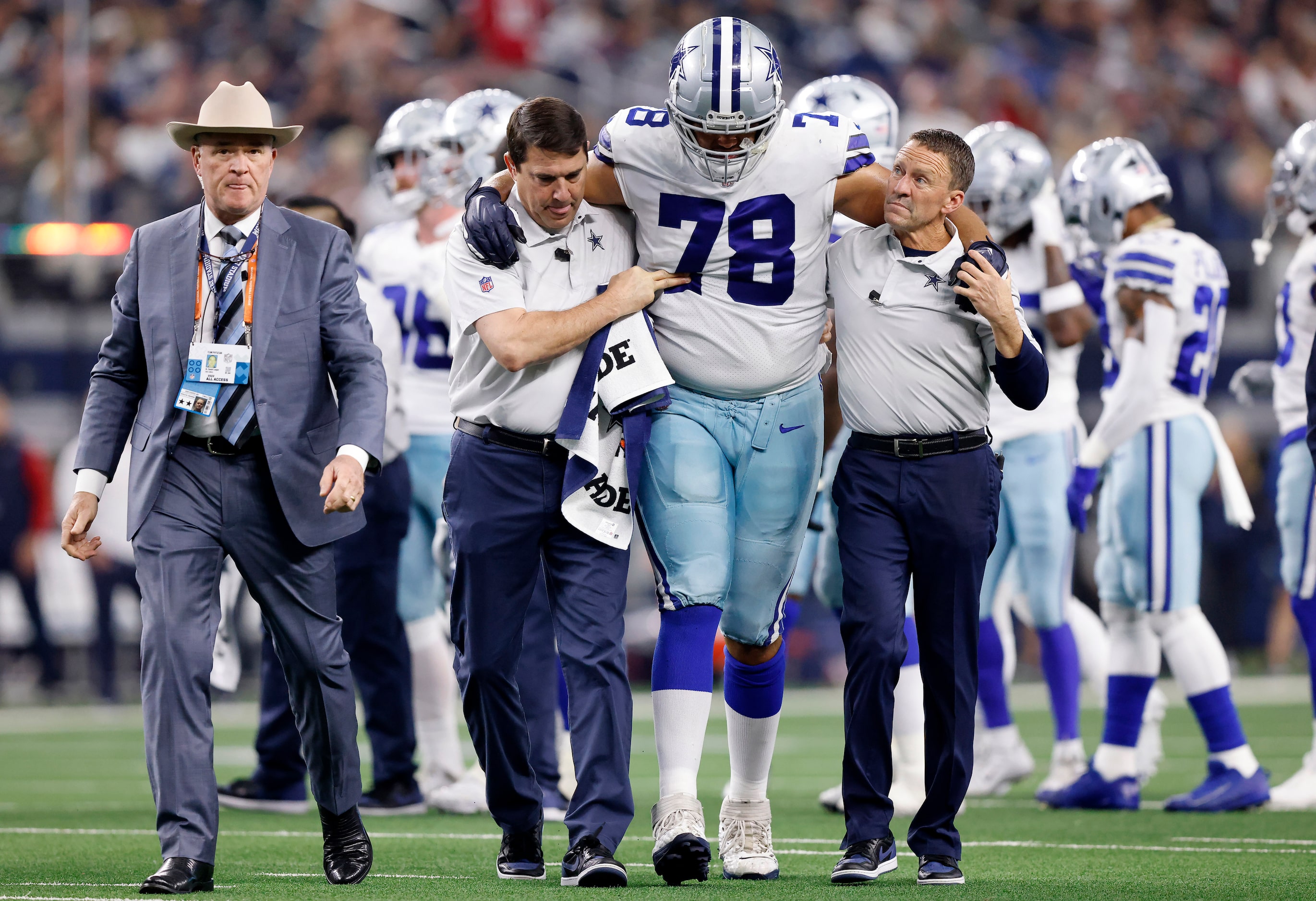 Dallas Cowboys offensive tackle Terence Steele (78) is walked to the locker room after...