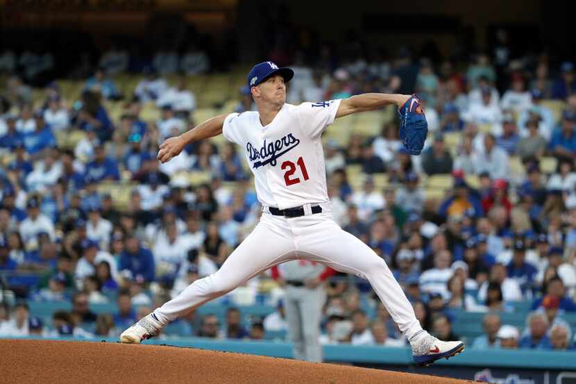 Los Angeles Dodgers pitcher Walker Buehler works against the Washington Nationals in the...