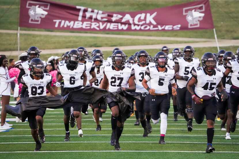Mansfield Timberview take the field before facing Waco University in a high school football...
