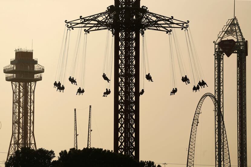 Six Flags Over Texas visitors ride the Texas SkyScreamer, the worlds tallest swing carousel...
