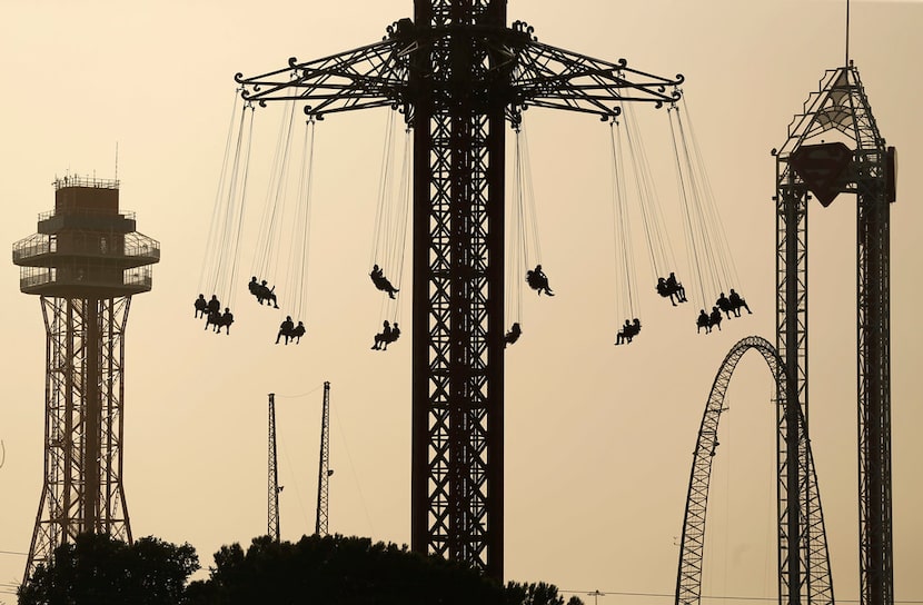 Six Flags Over Texas visitors rode the Texas SkyScreamer, the world's tallest swing carousel...