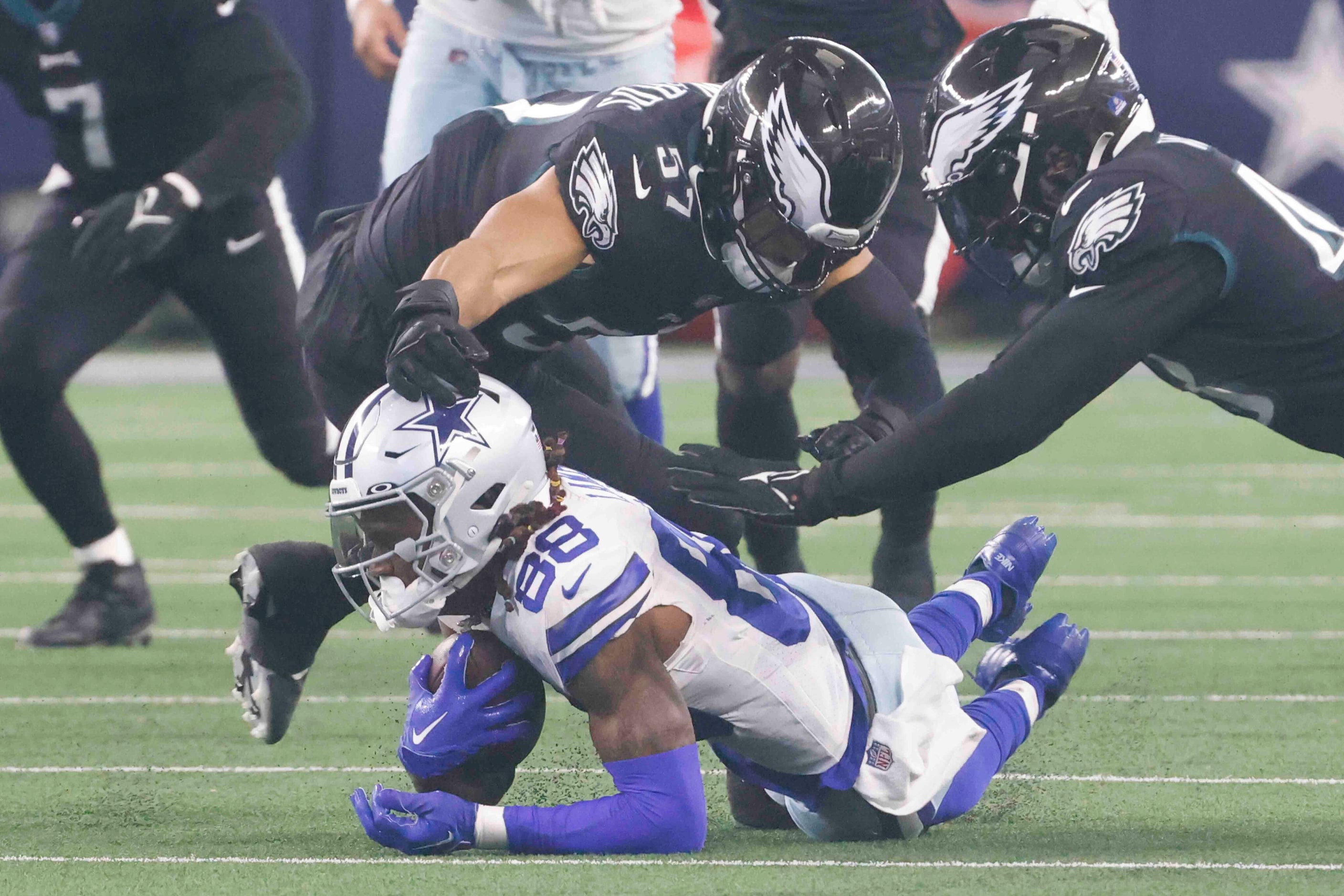 Dallas Cowboys wide receiver CeeDee Lamb (88) get tackled by Philadelphia Eagles linebacker...