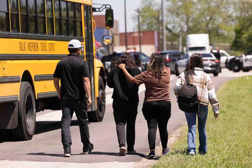 A family leaves after parents where allowed on campus to pick up students at Wilmer-Hutchins...