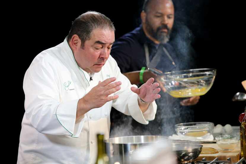 Chef Emeril Lagasse prepares food on stage during the Grand Tasting at the New York City...