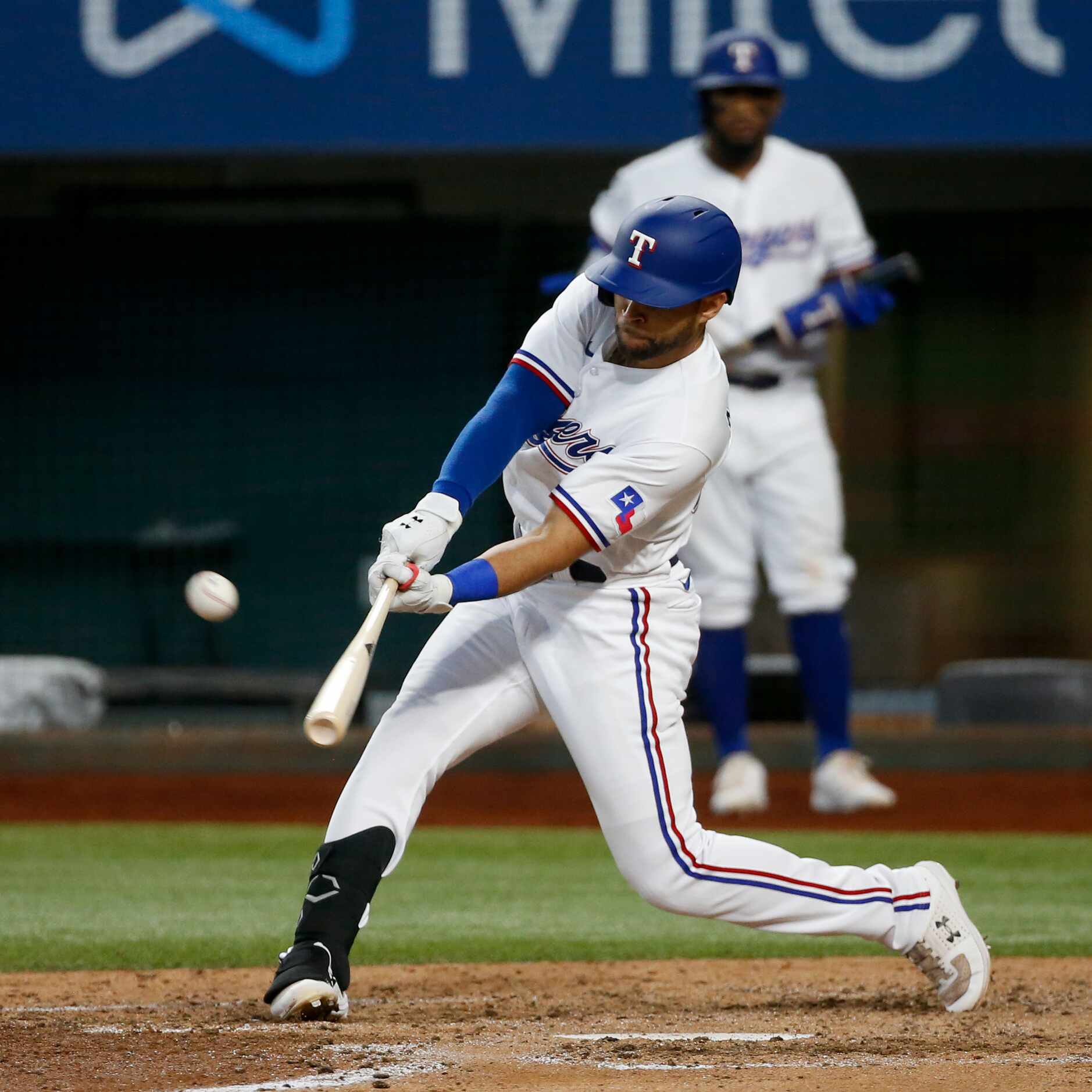 Texas Rangers left fielder Jason Martin (50) hits a three-run homerun during the bottom of...