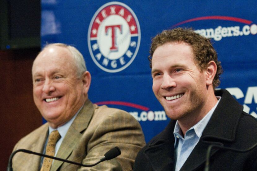 Nolan Ryan (left) and outfielder Josh Hamilton comment on the announcement of the signing of...