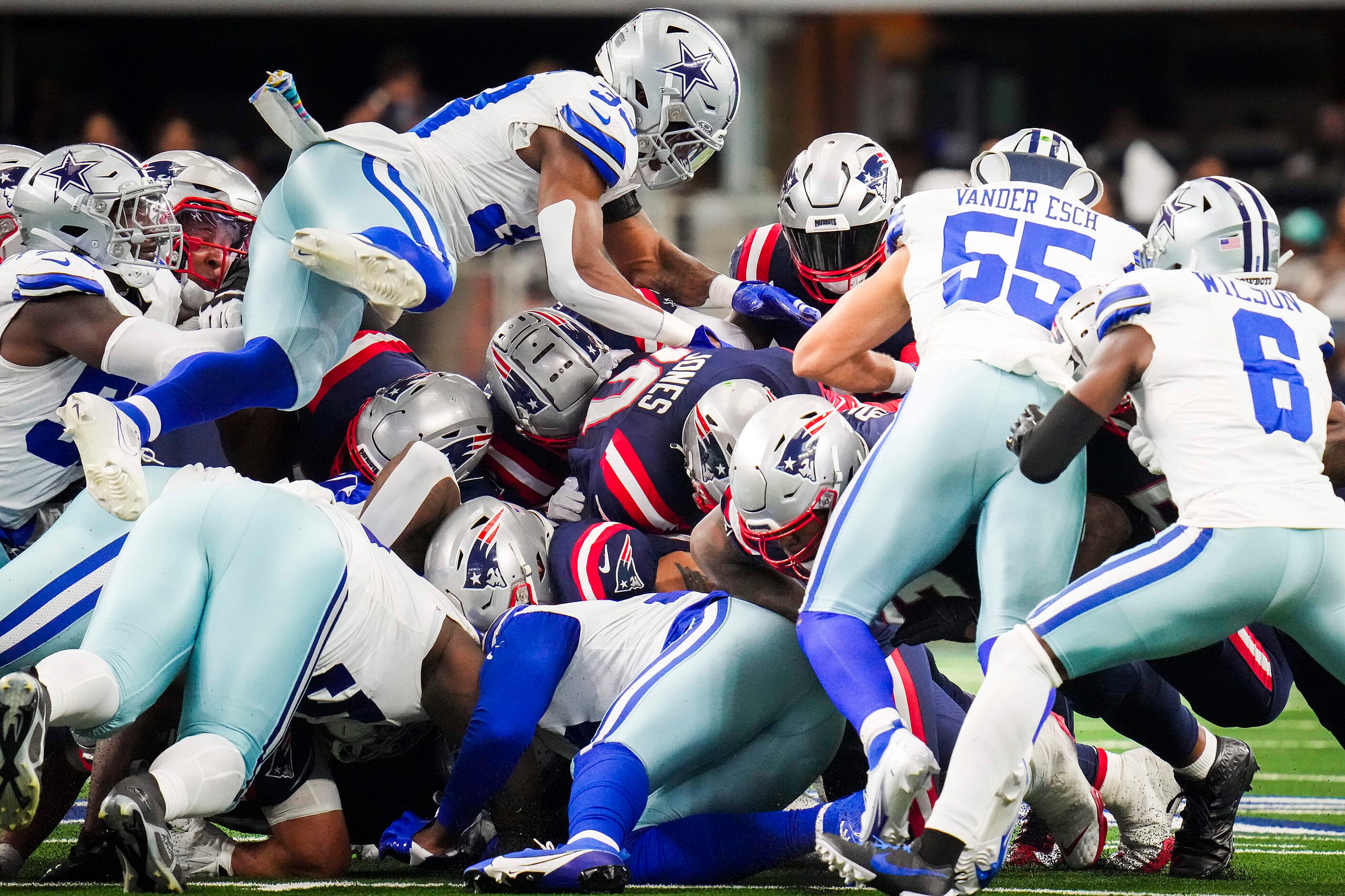 New England Patriots quarterback Mac Jones (10) is stopped on a fourth-and-one at midfield...