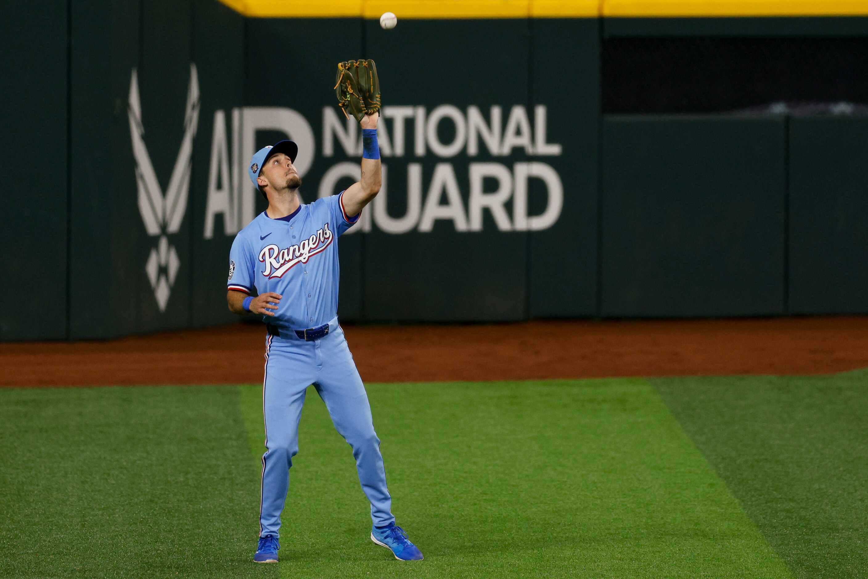 Texas Rangers left fielder Evan Carter (32) makes a catch for an out during the eighth...