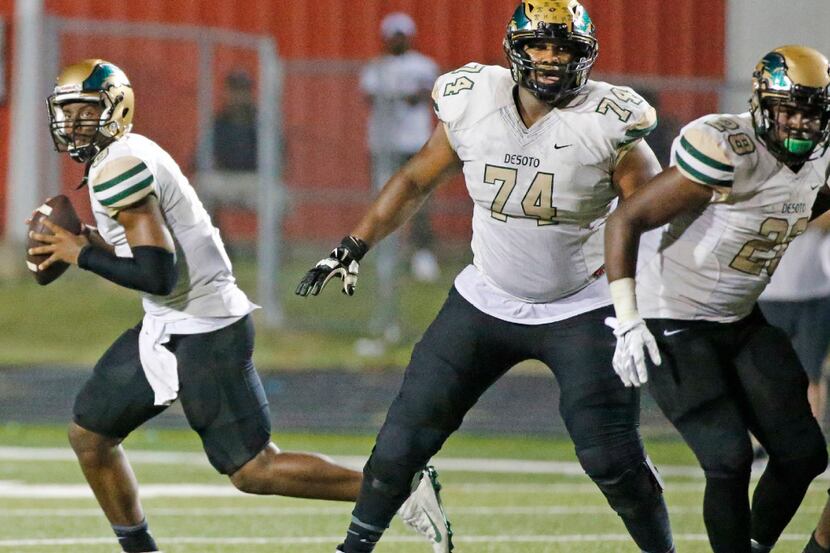 DeSoto quarterback Shawn Robinson (3) is pictured in action behind offensive lineman Edward...
