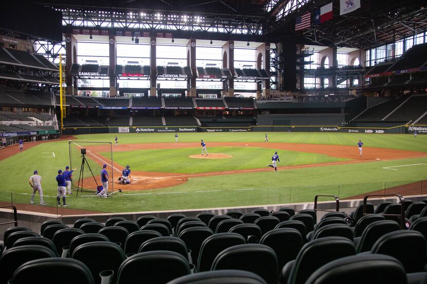 The Texas Rangers players play a simulated game during their third Summer Camp workout on...