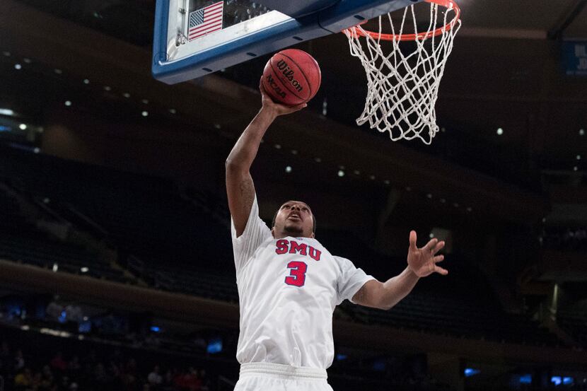 SMU guard Sterling Brown shoots during the second half of the team's NCAA college basketball...