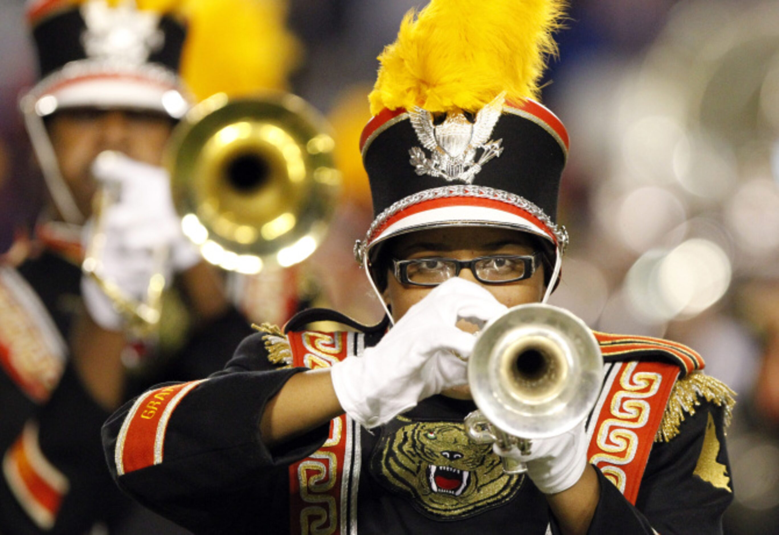 A Grambling band trumpet player concentrates as she performs during the halftime show of a...