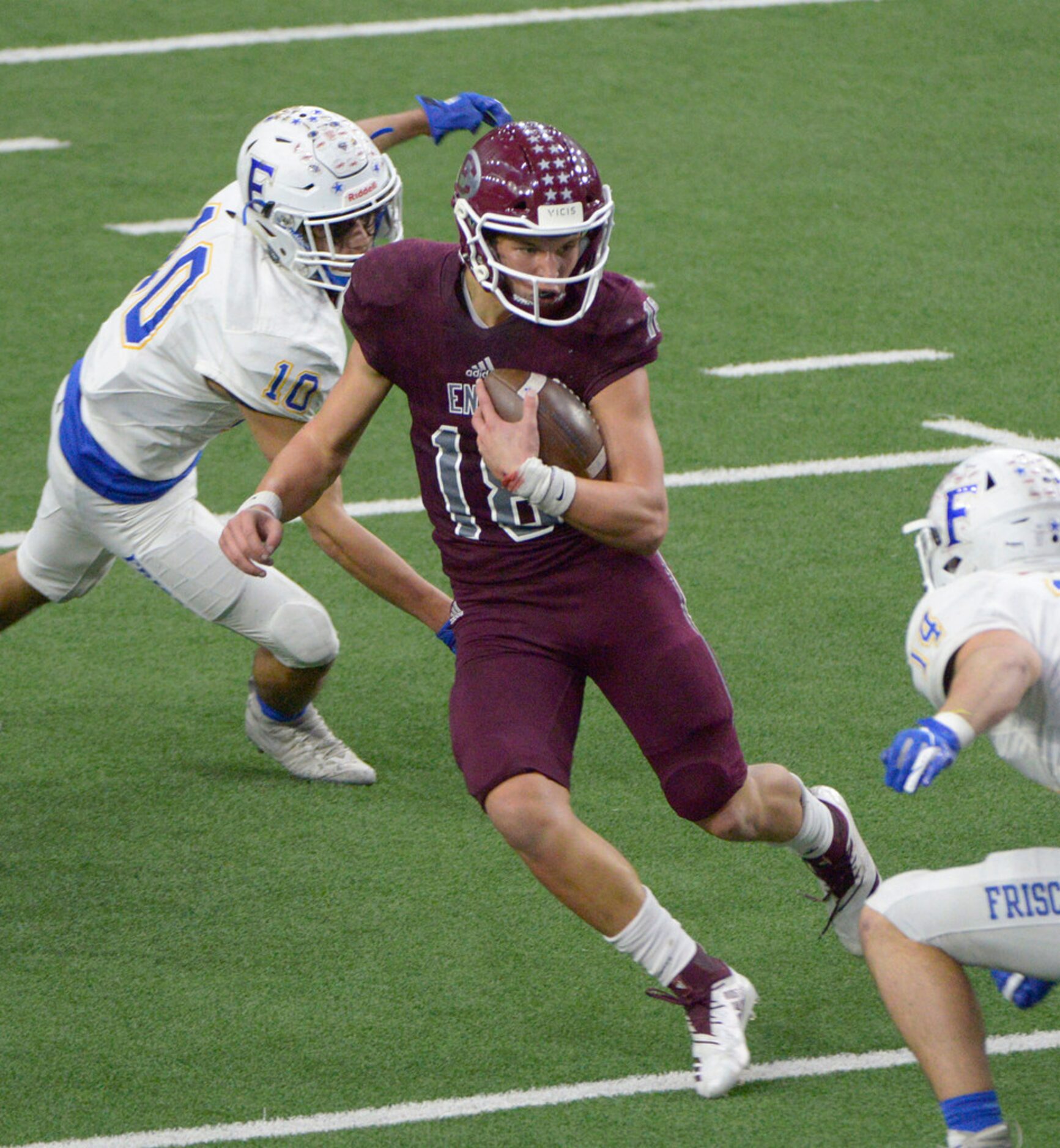 Ennis quarterback Collin Drake (18) looks for running room between Frisco's Nick Bonilla...