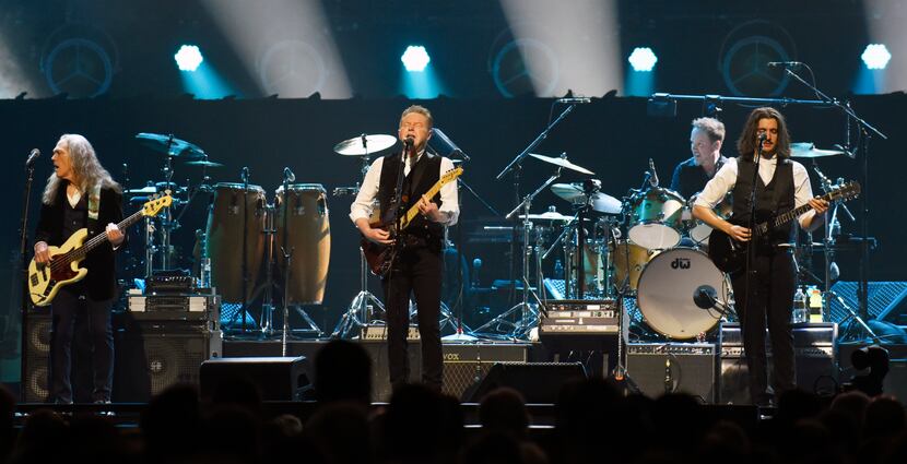 Don Henley, center, performs with other members of the American rock band the Eagles at the...