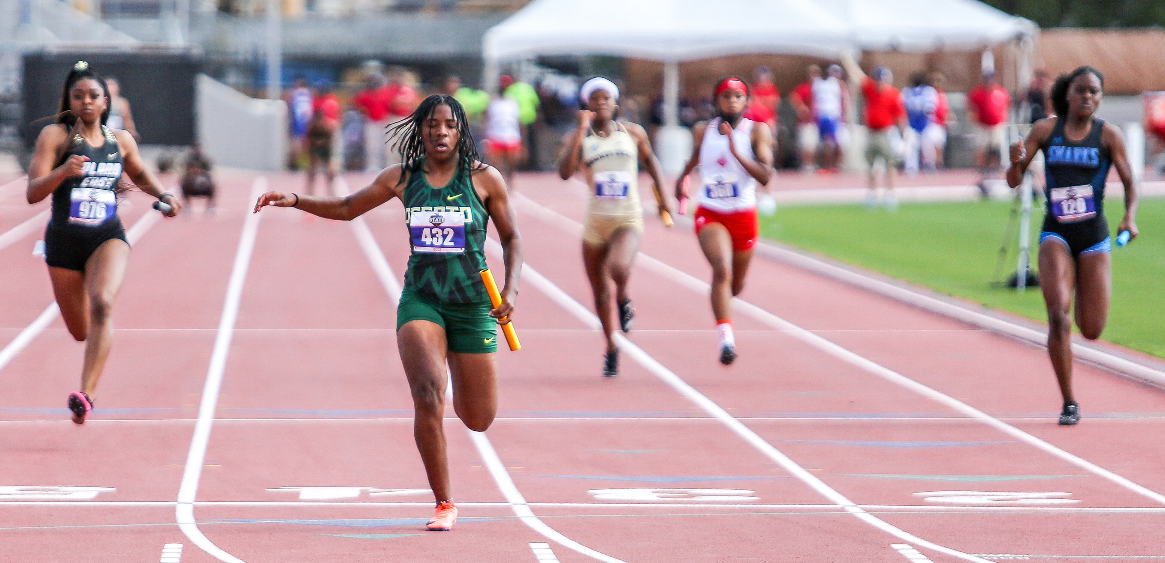 Mia Abraham of DeSoto crosses the finish line in third place in the 6A Girls 4x100 meter...