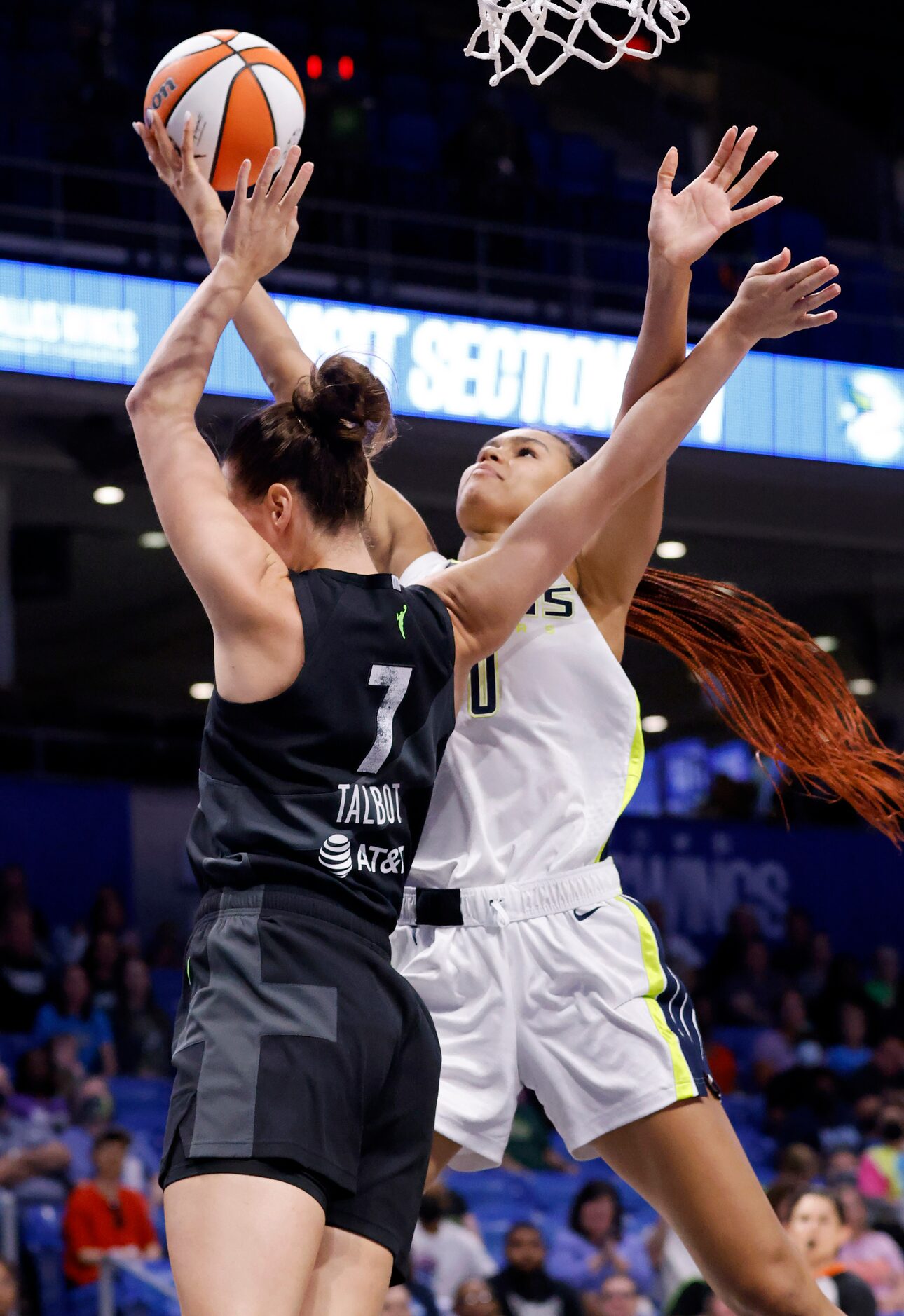 Dallas Wings forward Satou Sabally (0) puts up a shot against Seattle Storm forward...