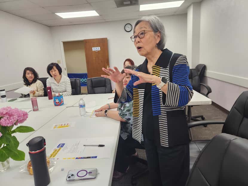 Lisa Chang Ahnert speaks to other board members of the Dallas Chinese Community Center in...