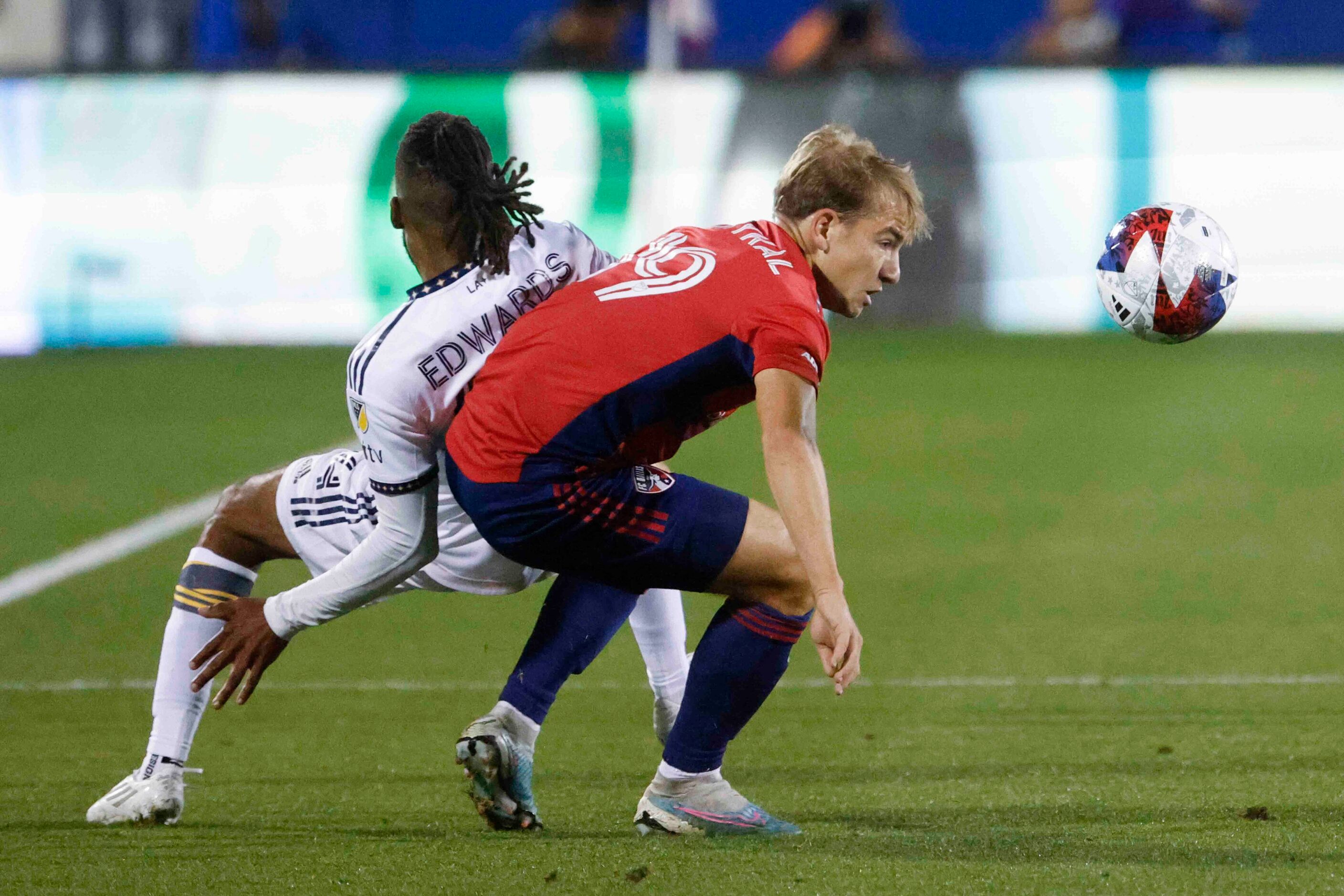 Los Angeles Galaxy forward Raheem Edwards (left) and FC Dallas midfielder Paxton Pomykal...