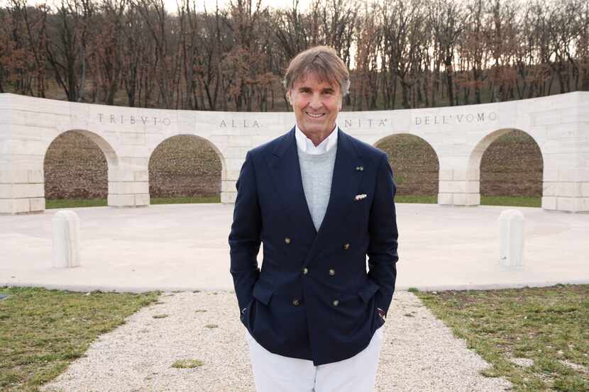 Italian fashion designer Brunello Cucinelli is standing in front of the monument called...