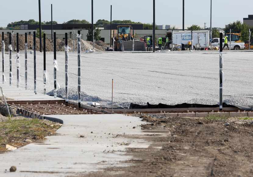 A closed portion of sidewalk leads to the construction being done at the McKinney Soccer...
