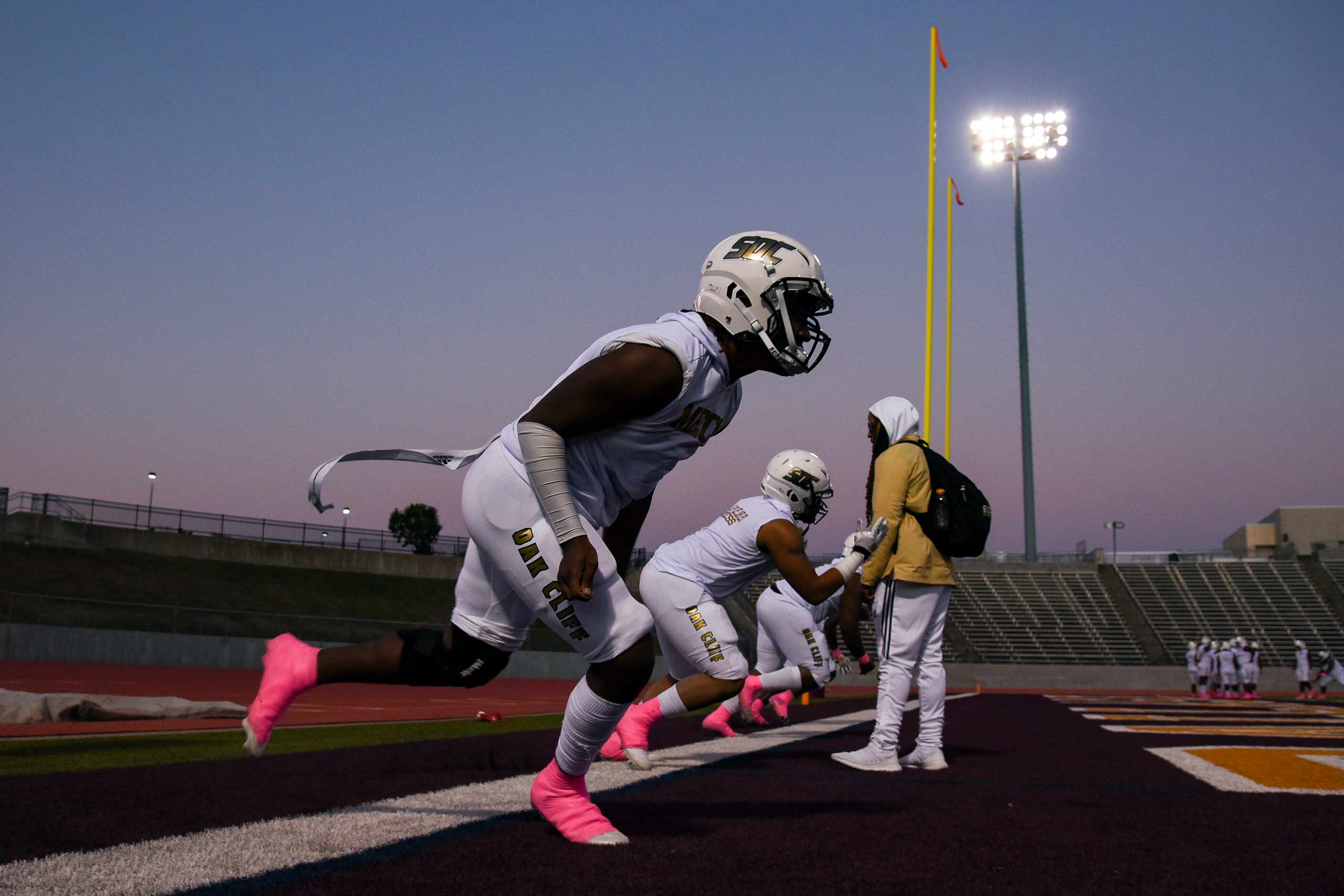 South Oak Cliff players warm up before the start of the District 6-5A Division II title game...
