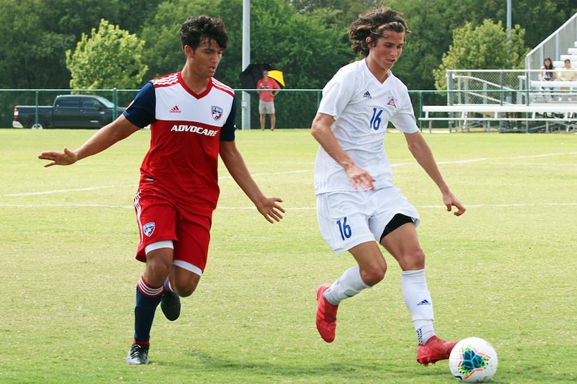 Nathan Toledo of the FC Dallas U19s defends Bailey Sparks of Solar SC.