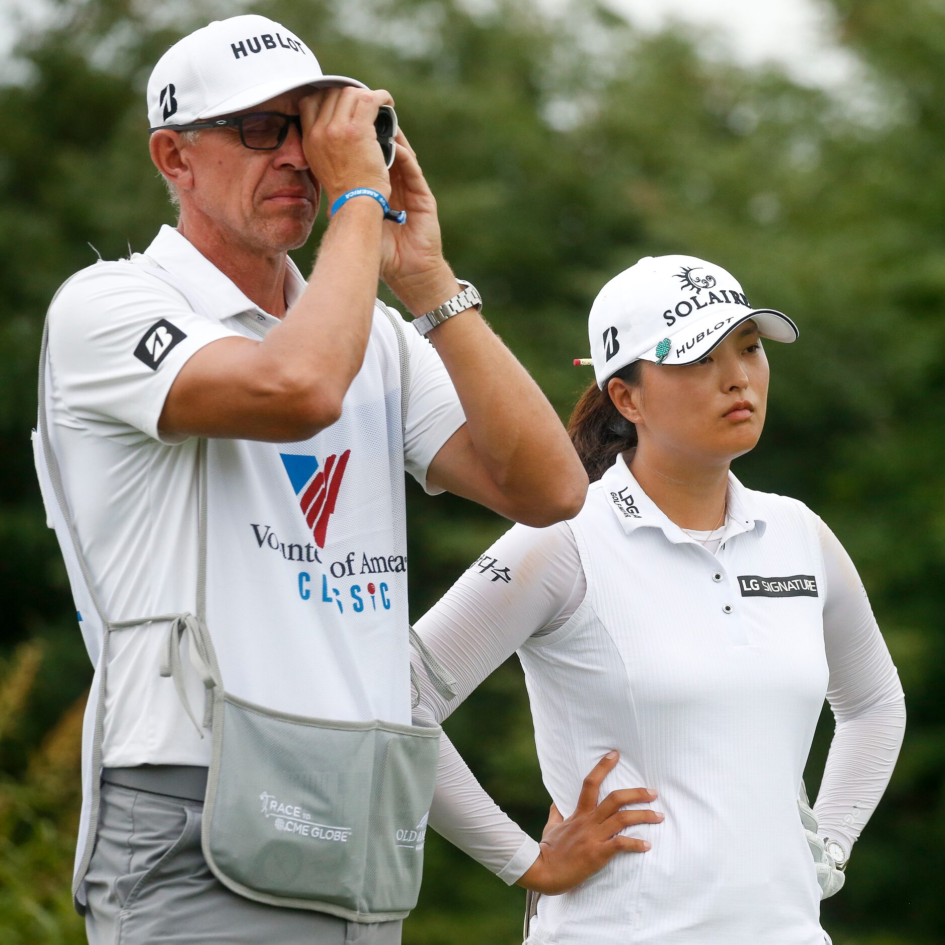 Professional golfer Jin Young Ko stands on the No. 15 tee box as her caddie David Brooker...