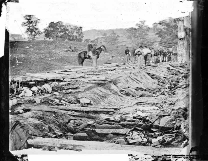 Ditch with bodies of soldiers on right wing used as a rifle pit by Confederates at Antietam,...
