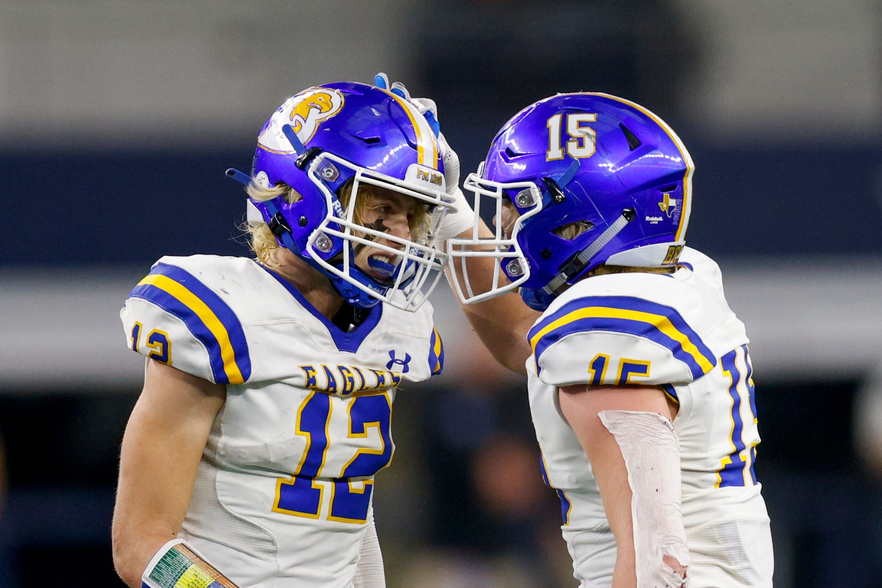 Brock wide receiver Elijah Potts (12) and Brock linebacker Cooper Massey (15) celebrate...