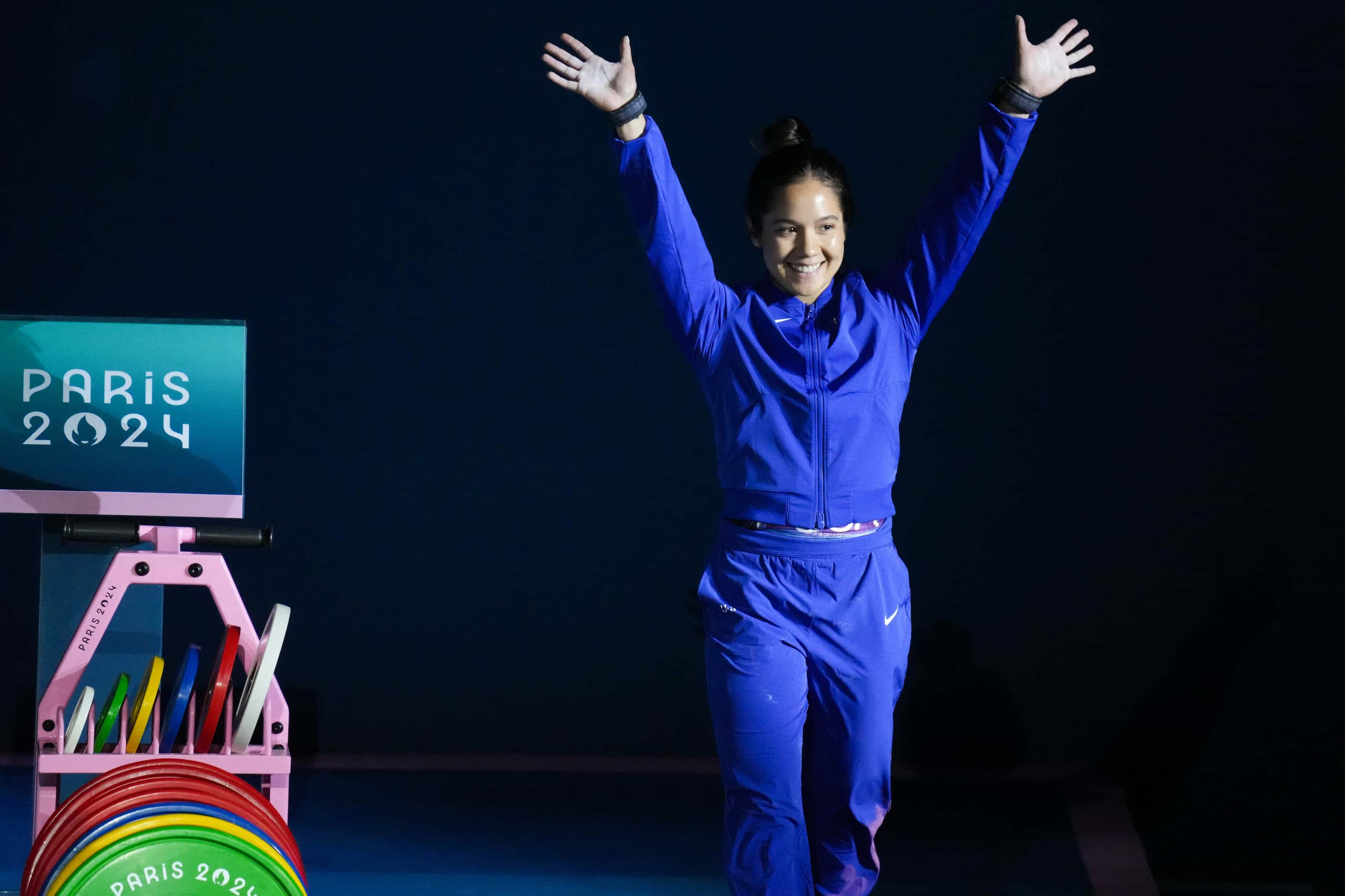 Jourdan Delacruz of the United States waves as she is introduced before women’s 49kg...