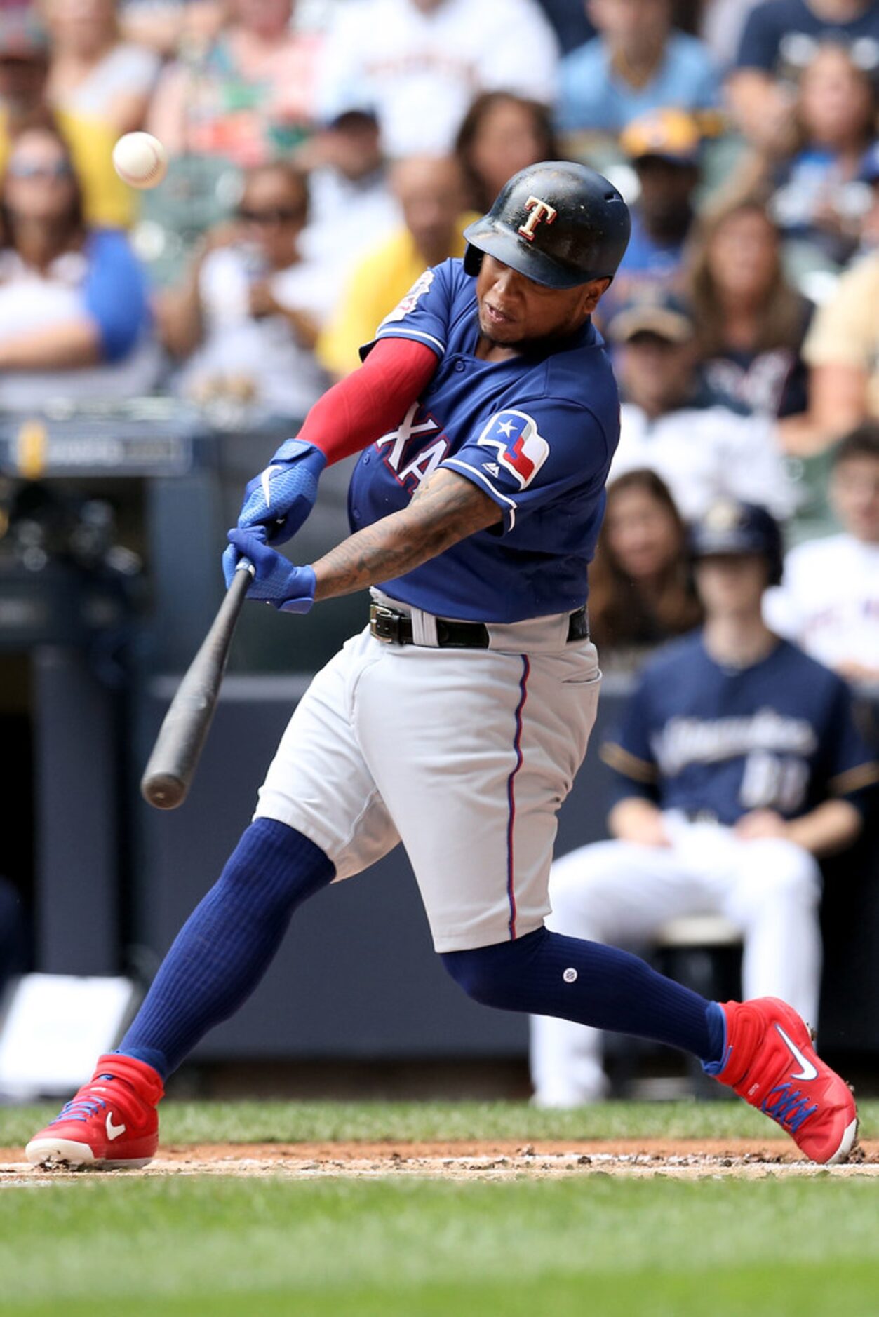 MILWAUKEE, WISCONSIN - AUGUST 11:  Willie Calhoun #5 of the Texas Rangers flies out in the...