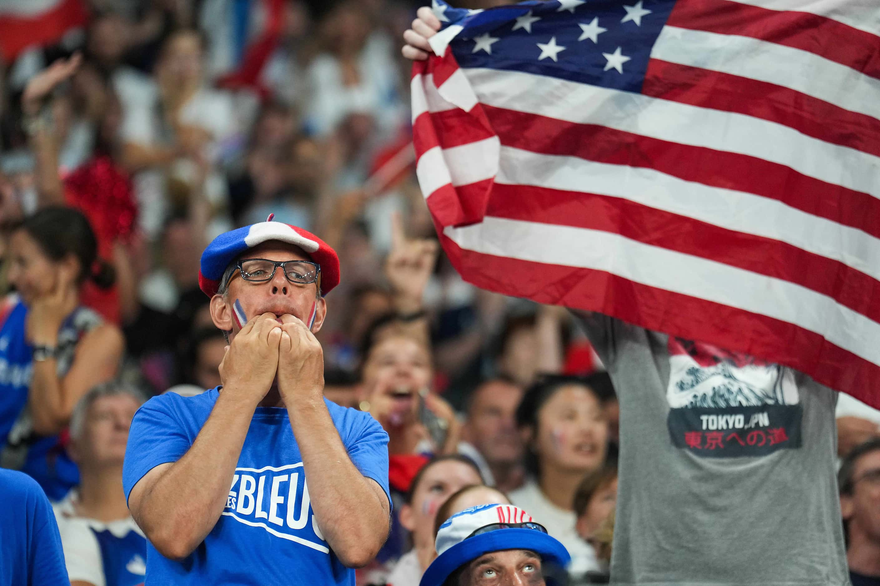 Fans cheer France and the United States during the second half of the women’s gold medal...