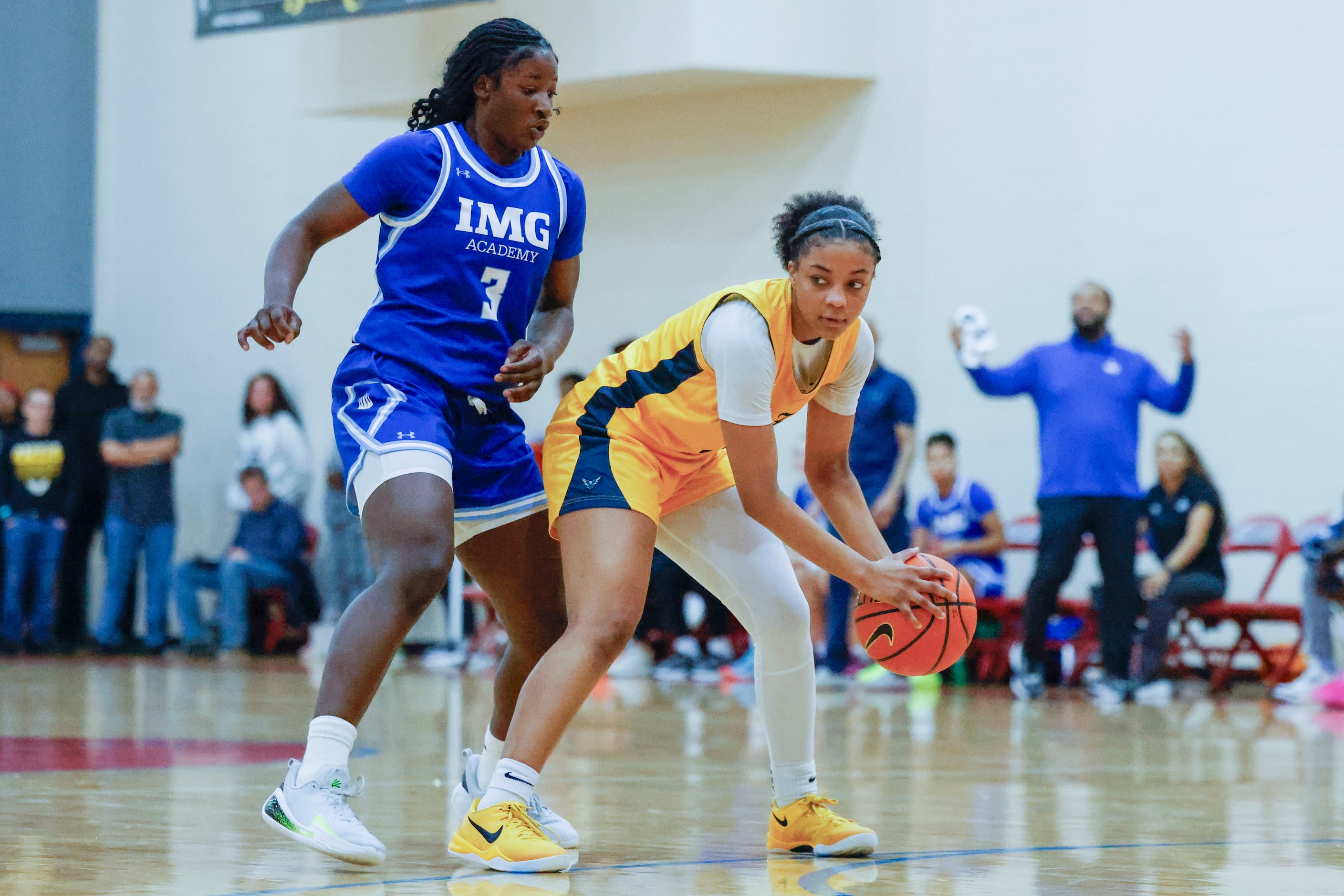 IMG Academy’s  Nylah Wilson (3) follows as Oak Cliff Faith Family Academy’s Gianna Jordan...