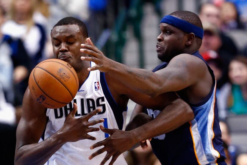 DALLAS, TX - DECEMBER 18:  Samuel Dalembert #1 of the Dallas Mavericks rebounds the ball...