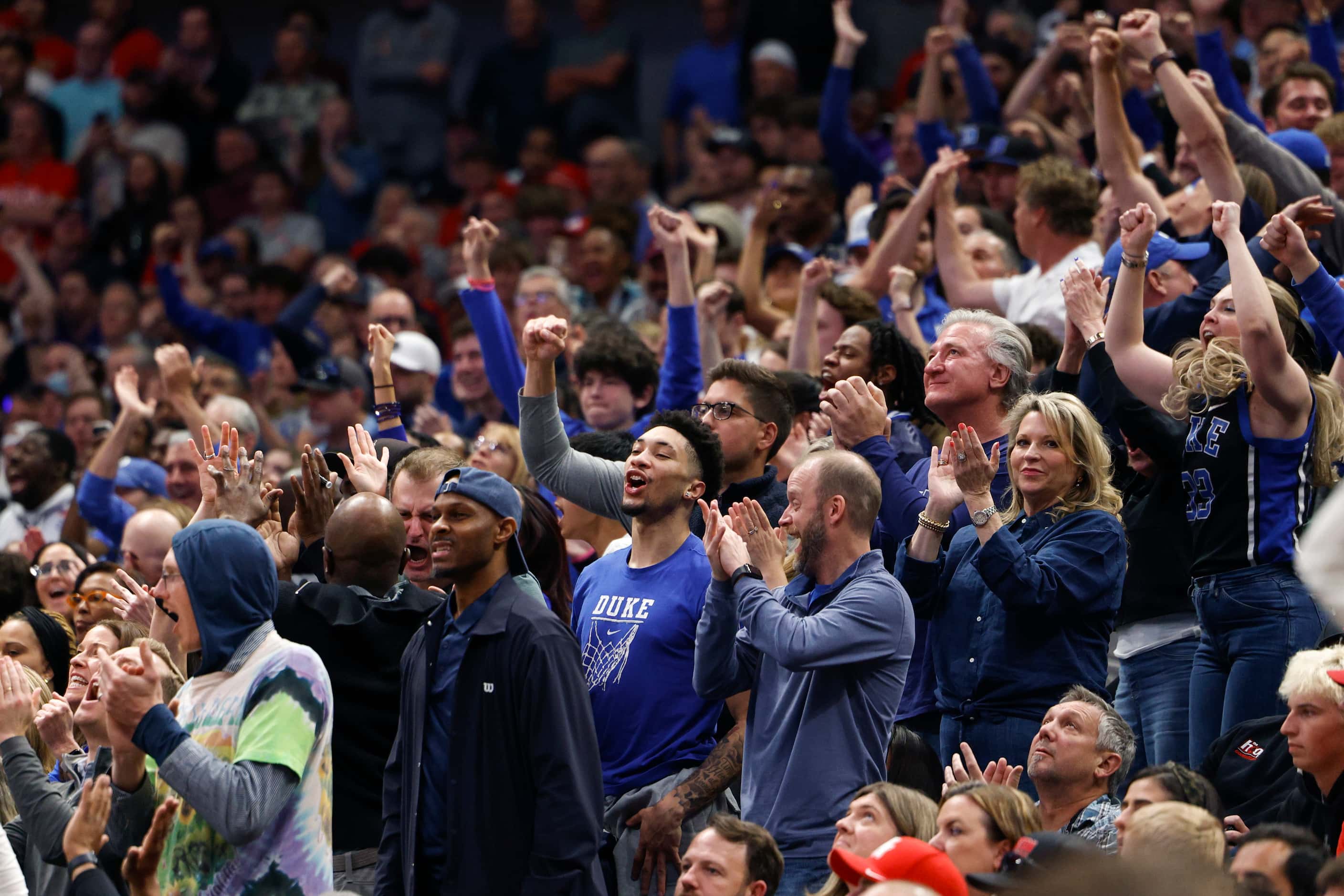 Duke fans cheer during the second half of an NCAA Men’s Sweet 16 basketball game against...