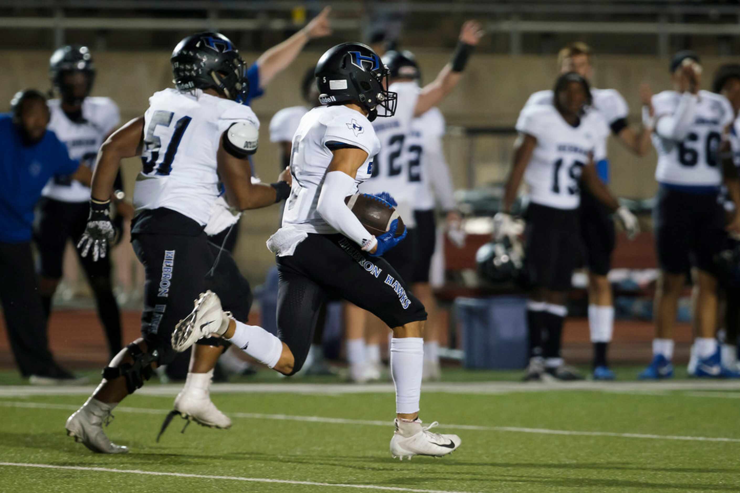 Hebron wide receiver Nick Frazier breaks free on a long touchdown during the first half of a...