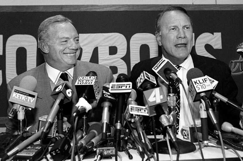 Barry Switzer (right) talks to the  press with Jerry Jones on March 30, 1994, at Valley...