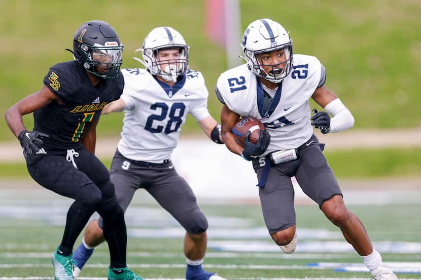Fort Worth All Saints wide receiver Jayvont Williams (21) runs the ball ahead of wide...