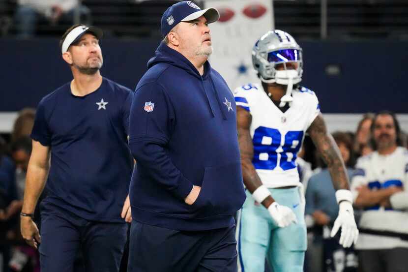 Dallas Cowboys head coach Mike McCarthy looks up with offensive coordinator Brian...