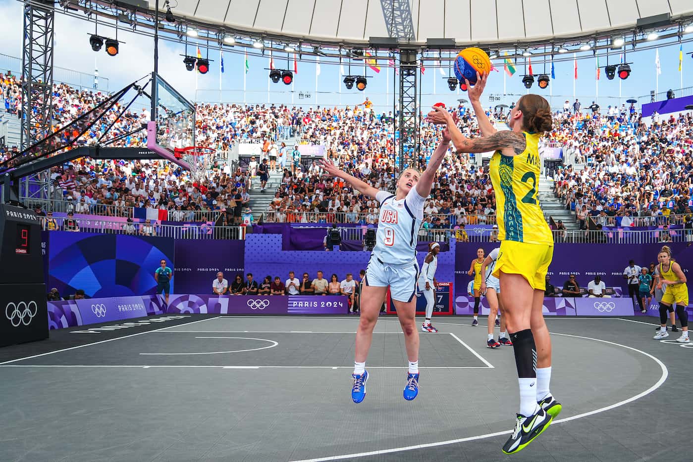 Anneli Maley of Australia shoots over Hailey van Lith of the United States during women’s...