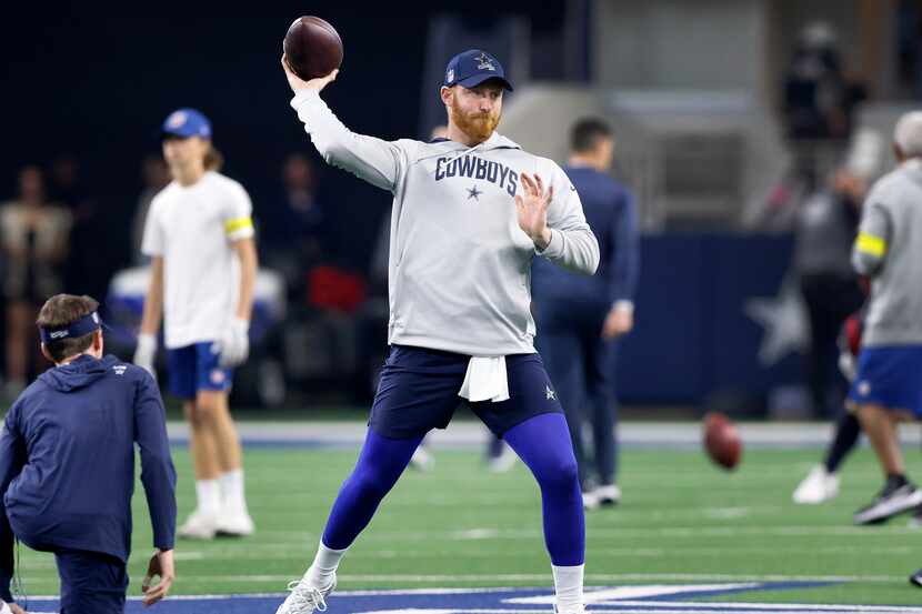 Dallas Cowboys quarterback Cooper Rush throws during pregame warmups before facing the...