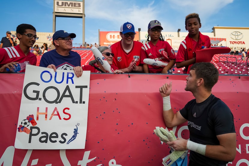 FC Dallas goalkeeper Maarten Paes celebrates with fans after a 2-1 victory over Sporting...