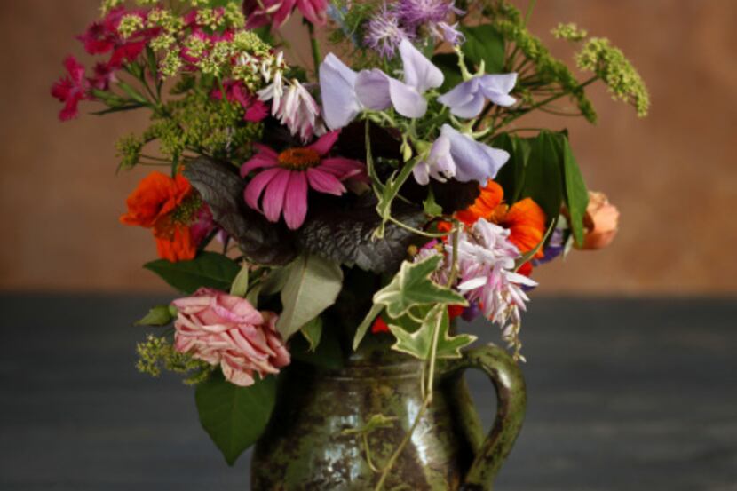 Pale lilac sweet peas in the bouquet's center is a fine companion to other homegrown flowers...