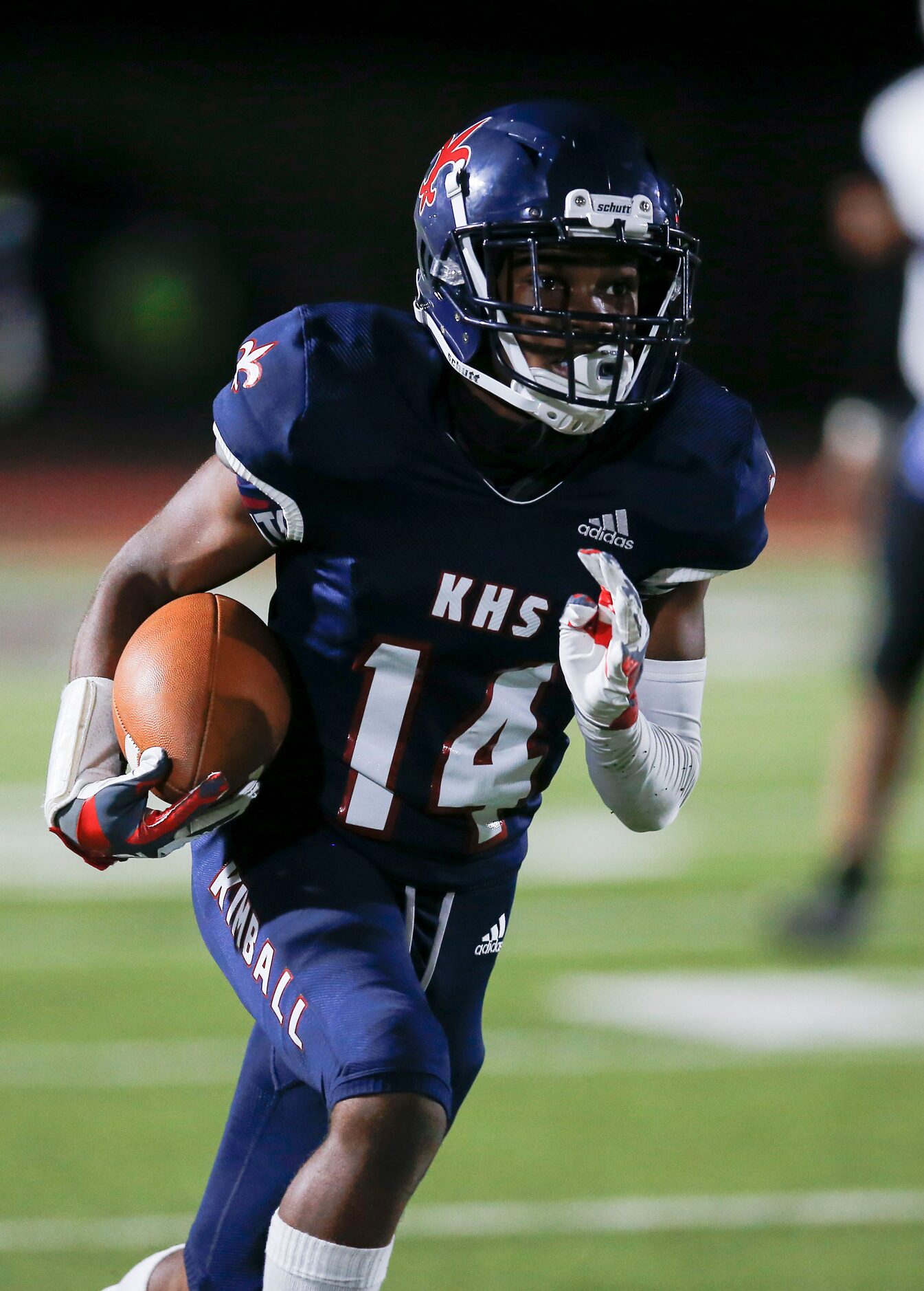 Kimball sophomore wide receiver Jordan Martin carries the ball during the first half of a...