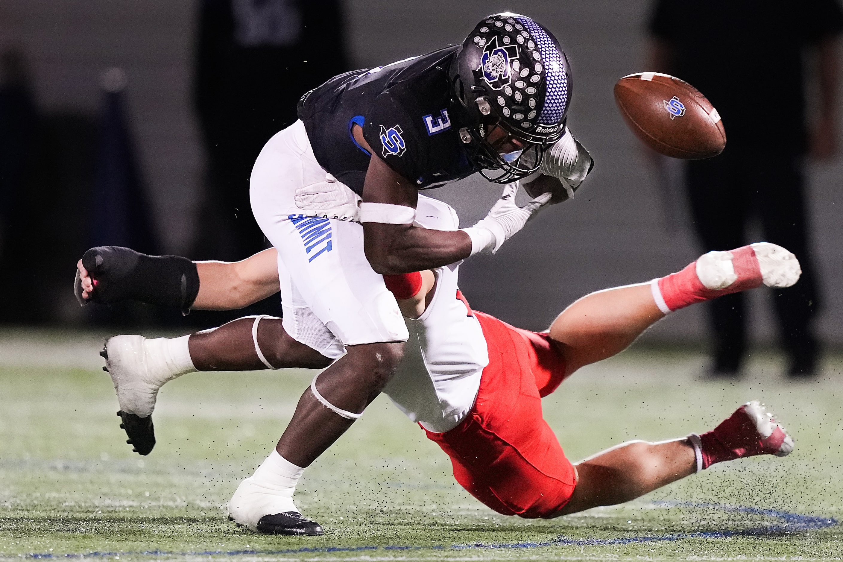 Mansfield Summit running back Adarion Nettles (3) loses a fumble as he is hit by Argyle...