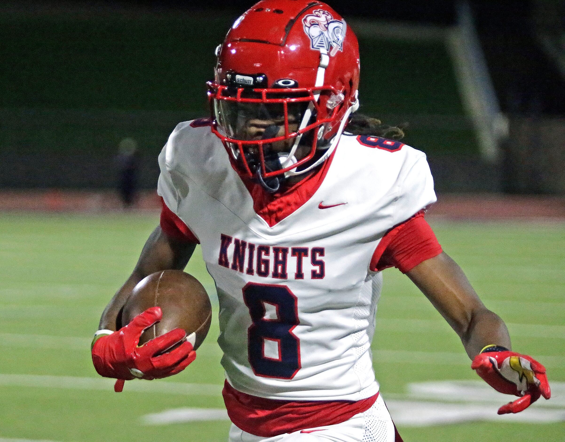 Kimball High School wide receiver Xavier Hampton (8) runs after a catch during the first...