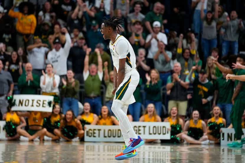 Baylor's Ja'Kobe Walter reacts after scoring a basket against Texas during the second half...