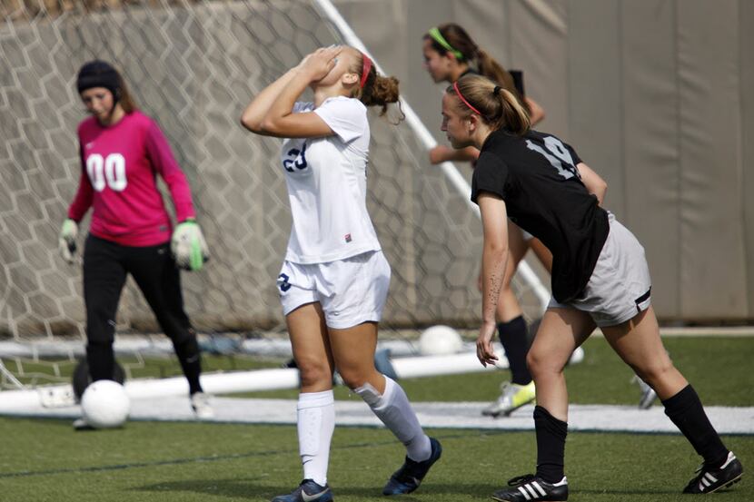 Wylie East player Brittany Jones (23) covers her face after a failed field goal attempt...