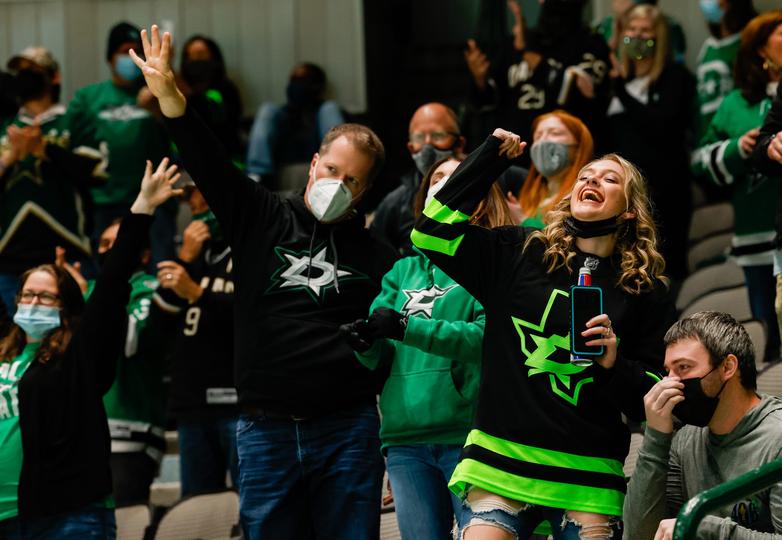 Dallas Stars fans celebrate a goal in the second period against the Columbus Blue Jackets at...