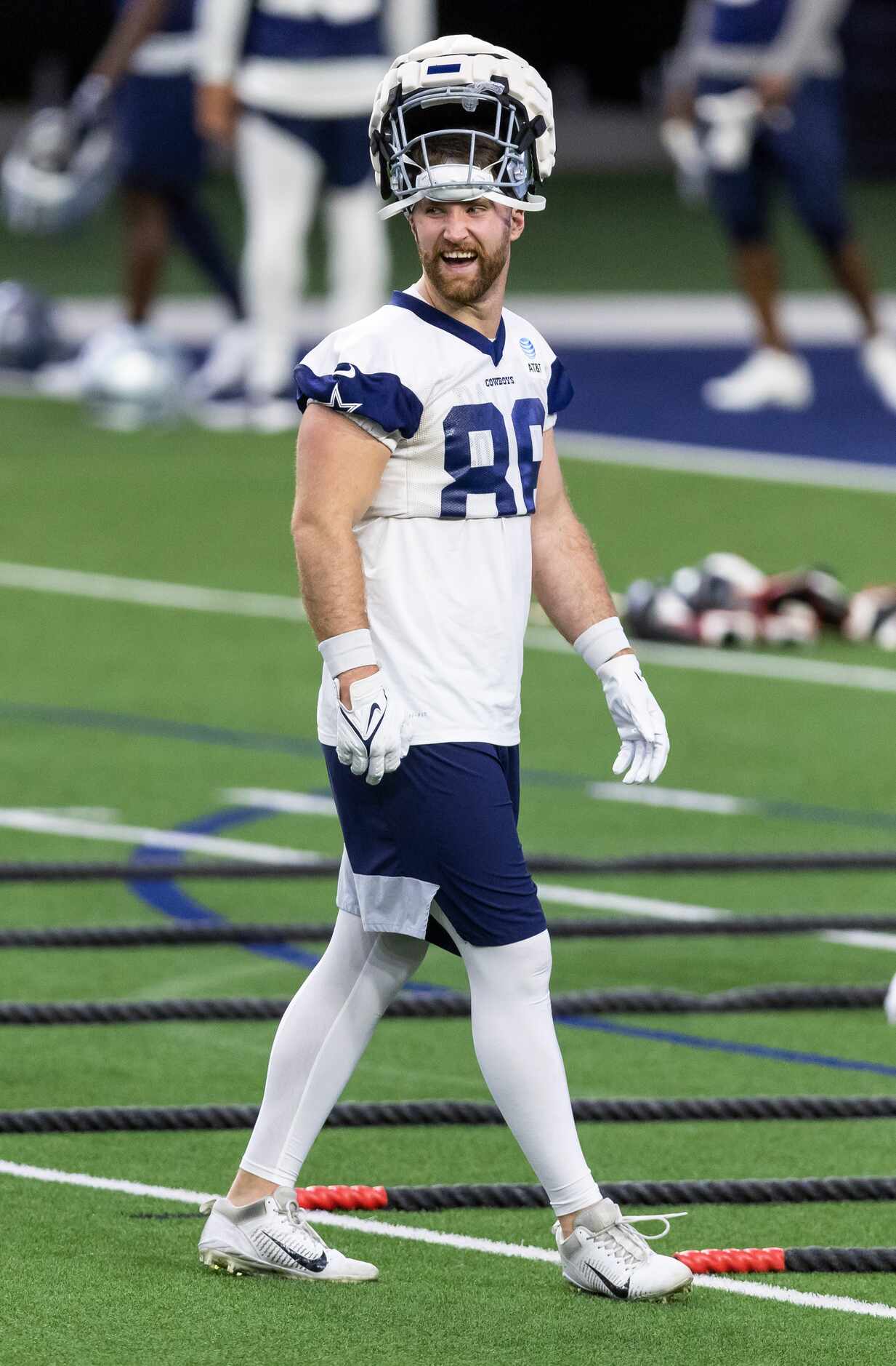 Dallas Cowboys tight end Dalton Shultz is seen wearing a padded cover on top of his normal...